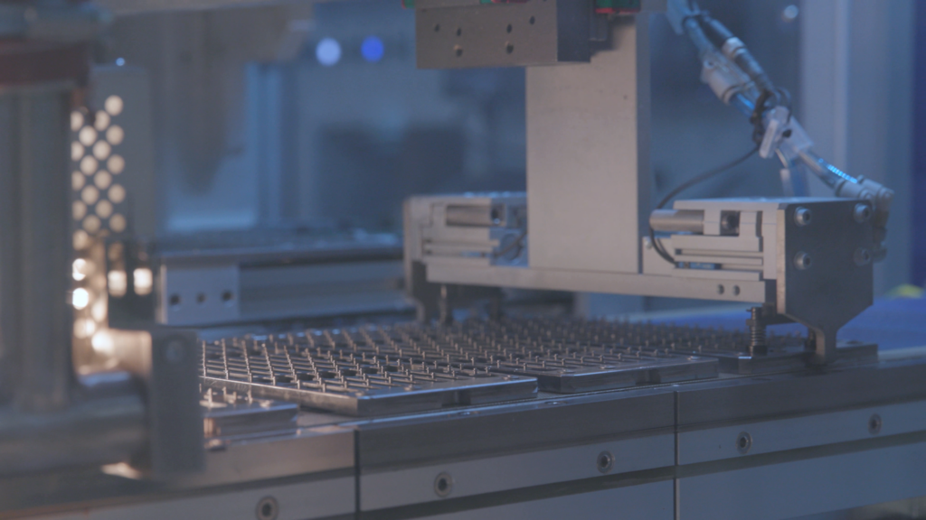 Automated cell interconnection equipment operating in a PV production line.