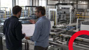 Engineer reviewing a solar technology partner's module production line